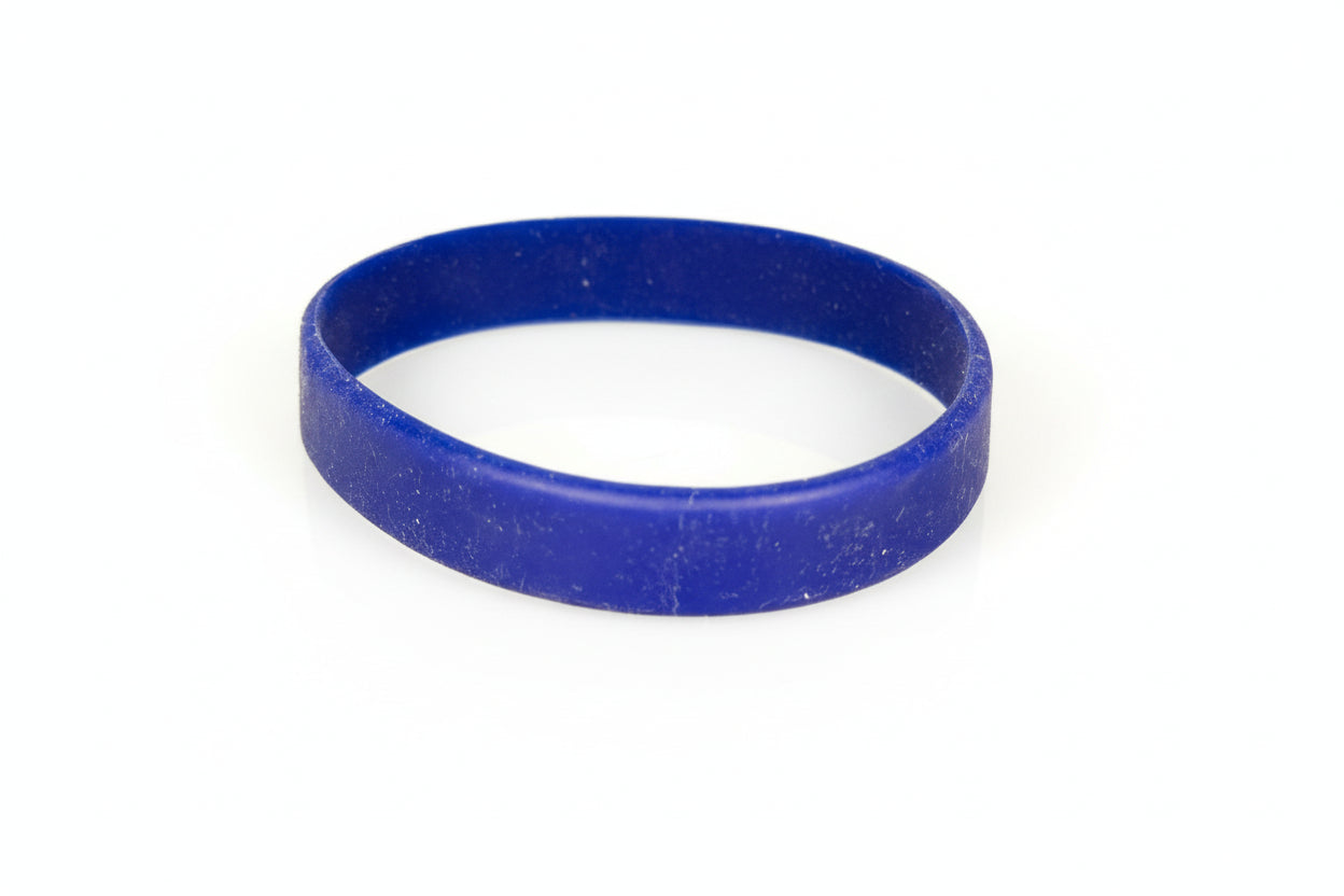 Blue rubber band on a white surface